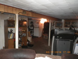fire damage restoration basement living room before