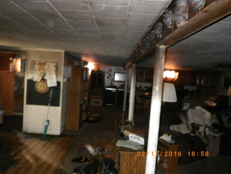 fire damage restoration basement living room before