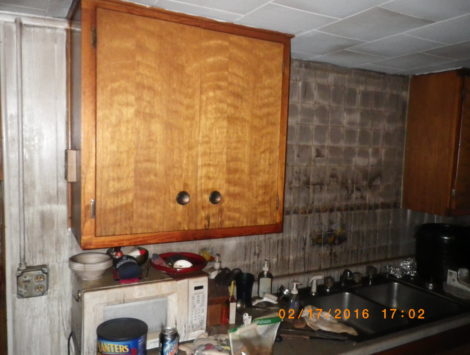 fire damage restoration basement kitchen before