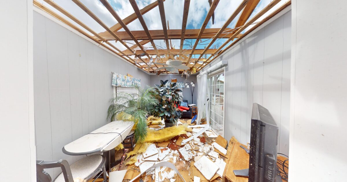 Wind damaged home before Swartz Restoration repaired the house.