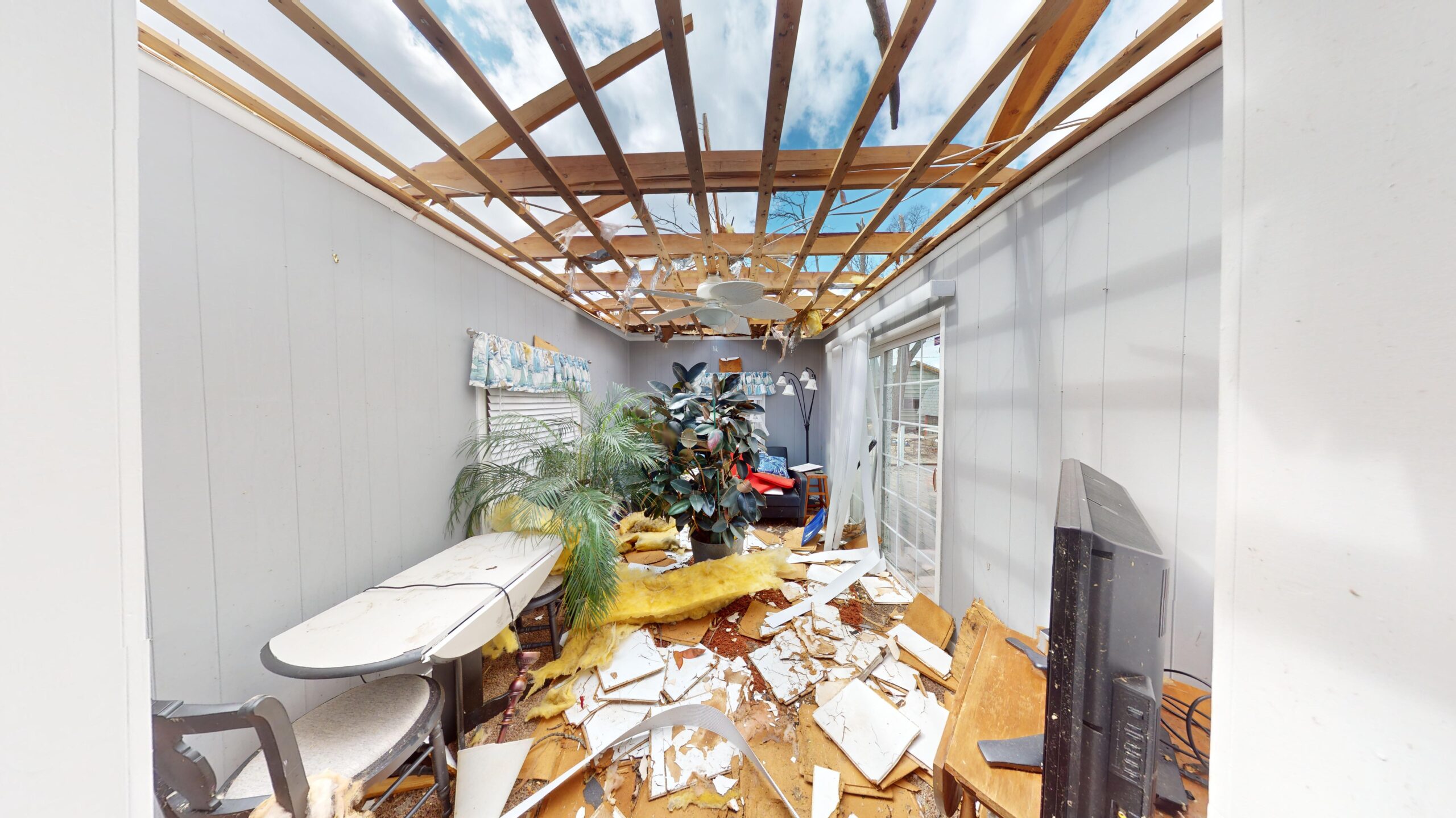 Wind damaged home before Swartz Restoration repaired the house.